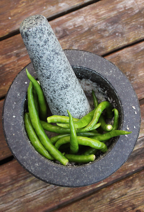 thai birds eye chillies in pestle and mortar