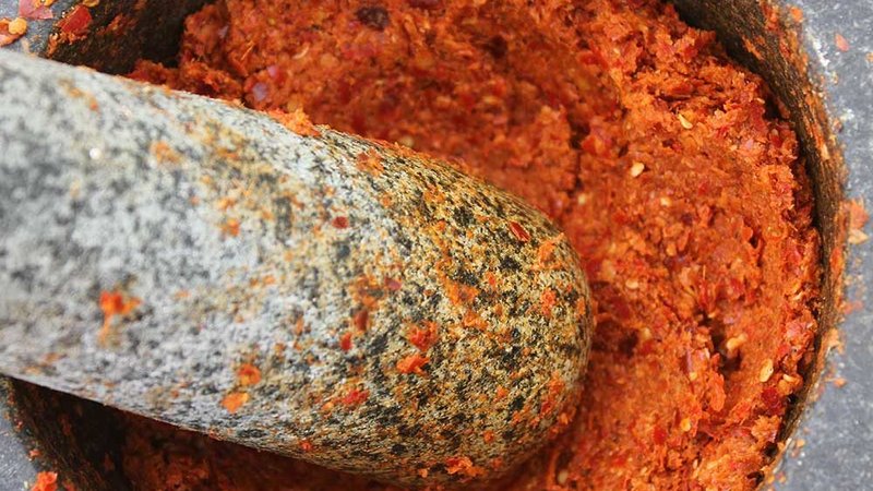 Homemade red Thai curry paste made from fresh authentic ingredients