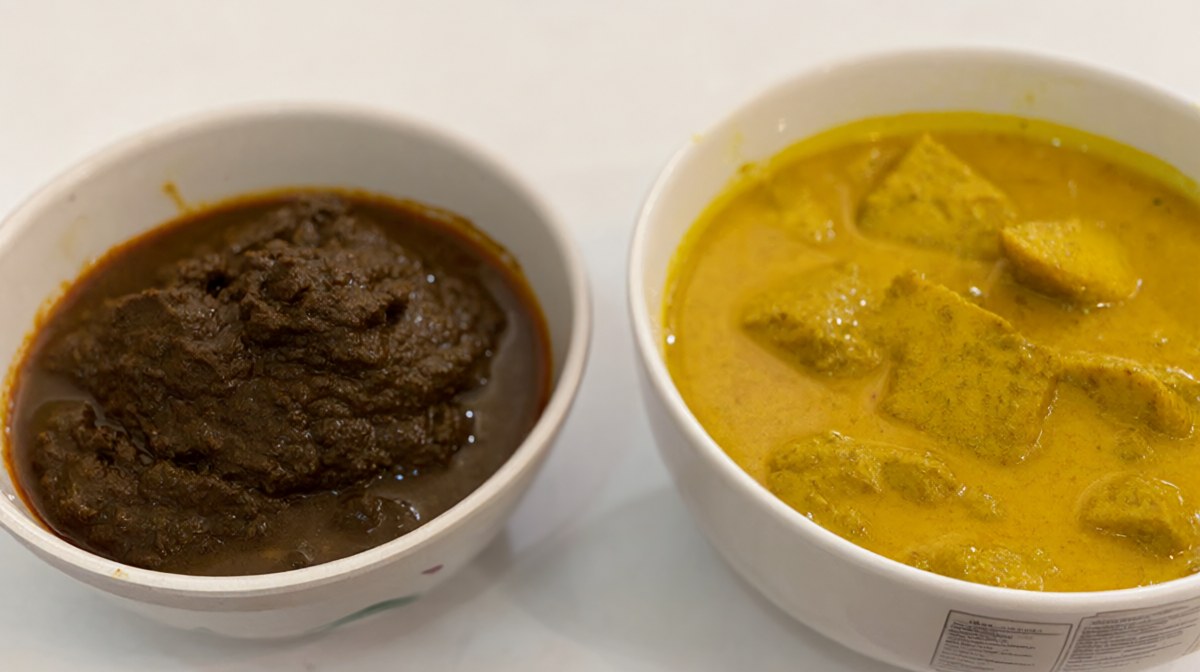 A bowl of dark brown curry paste beside a finished bowl of golden yellow curry, clearly different in colour and texture